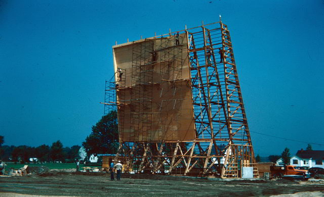 Starlite Drive-In Theatre - CLOSE-UP OF CARPENTERS WORKING ON THE TOP OF THE TOWER FRAME 